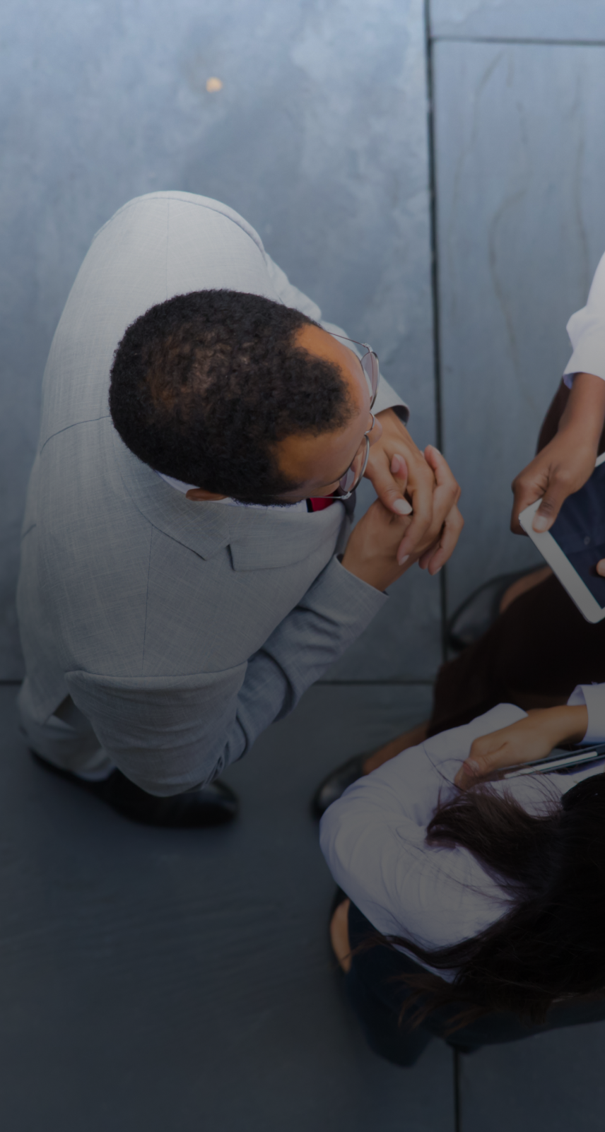 group of confident workers talking outdoors