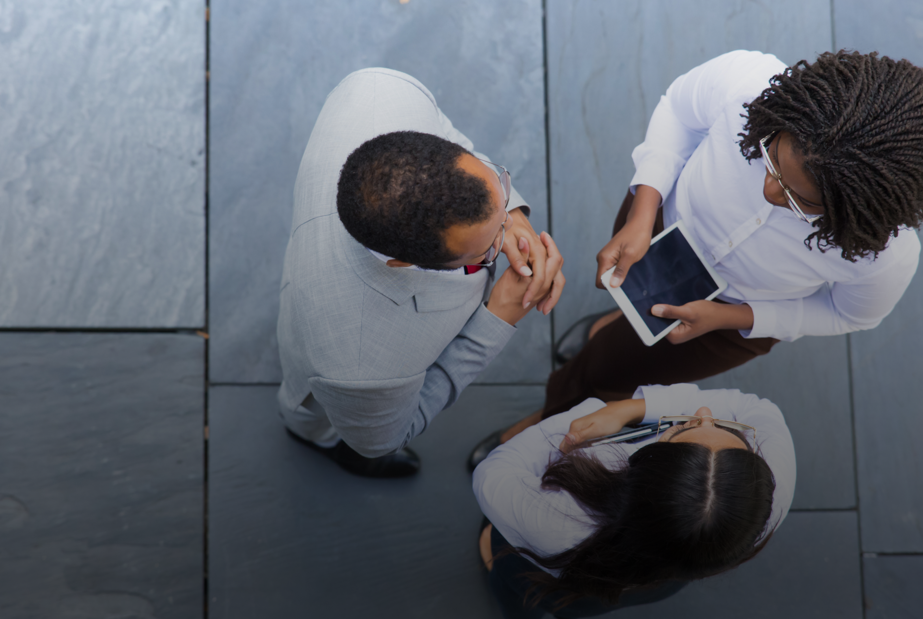 group of confident workers talking outdoors